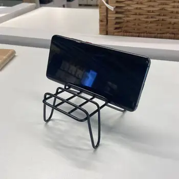 Ins Style Mobiliojo telefono laikiklis Juoda Modernus paprastas metalinis lygintuvas Horizontali vertikali kėdės forma Stalinis mobiliojo telefono laikiklis